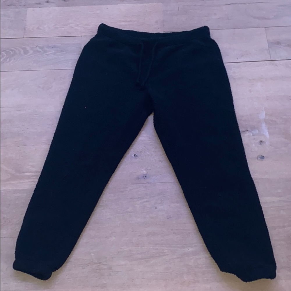 fuzzy black sweatpants.